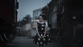 Woman Standing on Road Near Building during Blue Hour