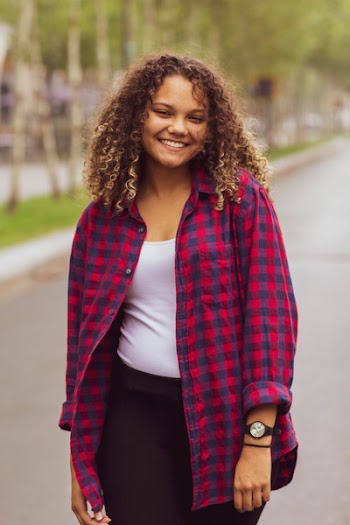 Woman Standing on Road While Smiling