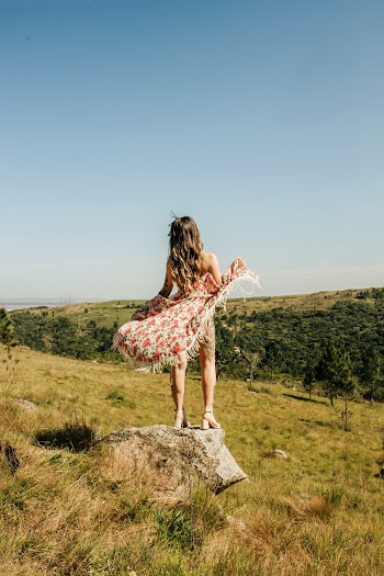 Woman Standing on Rock 