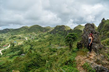 Woman Standing on Rock Formation