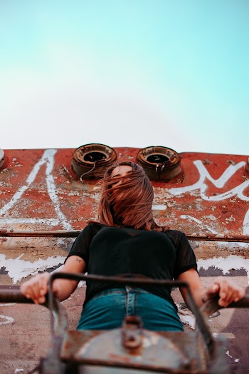 Woman Standing on Roof