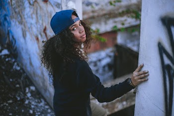 Woman Standing on Ruined Building