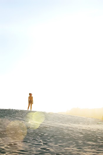 Woman Standing On Sand