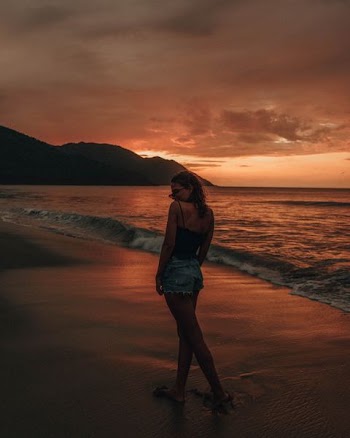 woman standing on sea shore