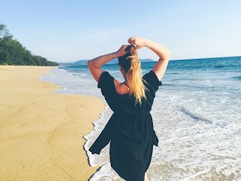 Woman Standing on Sea Shore
