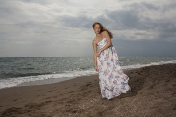 Woman Standing On Seashore
