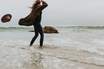 woman standing on seashore