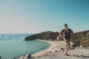 Woman Standing On Seashore