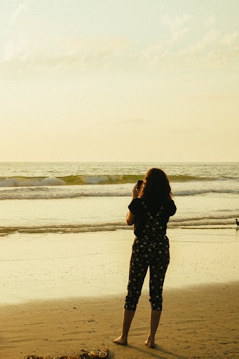 Woman Standing on Seashore