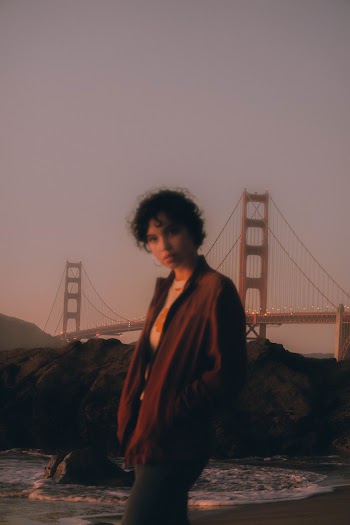 Woman Standing on Seashore Near Golden Gate Bridge
