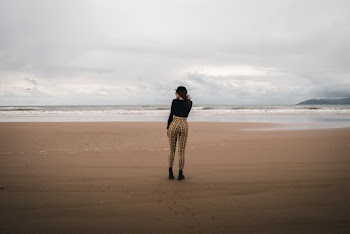 Woman Standing on Shoreline