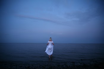 Woman Standing on Shoreline