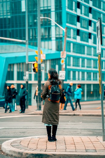Woman Standing on Side Walk