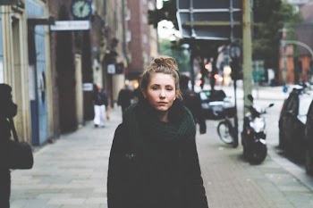 woman standing on sidewalk