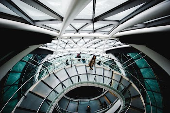 Woman Standing On Spiral Staircase