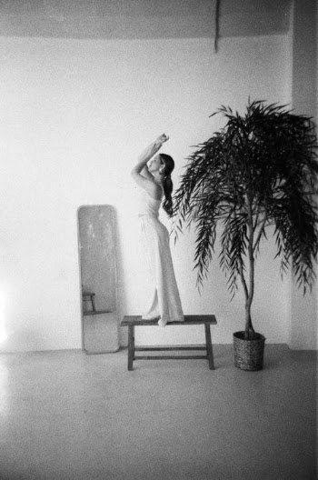 Woman Standing on Stool in Empty Room · Free Stock Photo