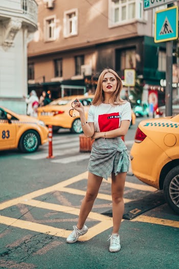 Woman standing on street posing 
