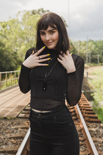 Woman Standing On Train Tracks
