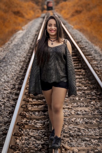 Woman Standing on Train Trail