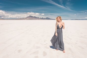 woman standing on white sands