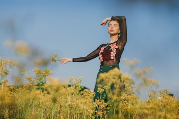 Woman Standing on Yellow Flowers