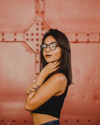 Woman Standing Touching Neck