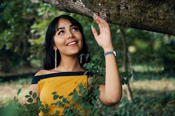Woman Standing Under a Tree