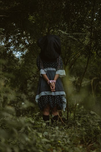 Woman Standing Under Tree