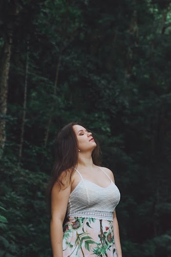 Woman Standing Under Tree Closing Her Eyes While Looking Up