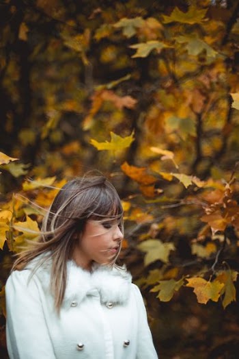 woman standing under tree during daytime