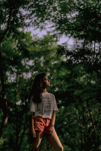 Woman Standing Under Trees