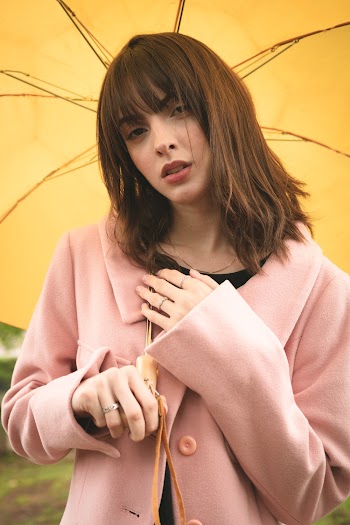 Woman Standing Under Umbrella