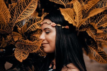 Woman Standing Under Yellow Leaves