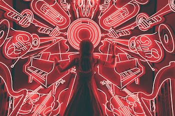 woman standing watching LED light musical instrument