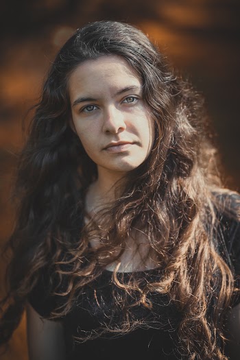 Woman Standing Wearing Black Scoop-neck Shirt