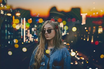 Woman Standing Wearing Blue Denim Jacket