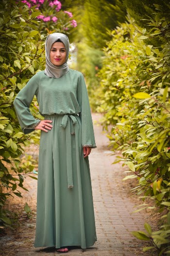 Woman Standing Wearing Gray Abaya Dress and Hijab