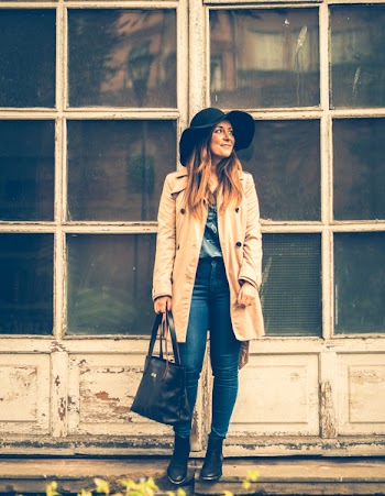 Woman Standing While Holding Black Tote Bag