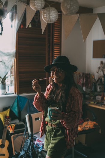 Woman Standing While Holding Blue Ceramic Mug