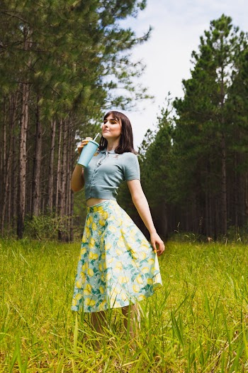 Woman Standing While Holding Blue Cup