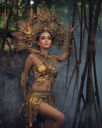 Woman Standing While Holding Branch