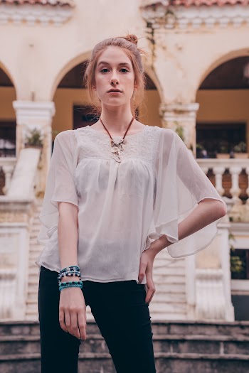 Woman Standing While Left Hand Akimbo Outdoors