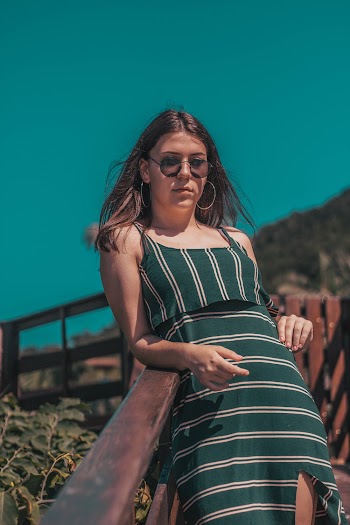 Woman Standing While Wearing Black Framed Sunglasses