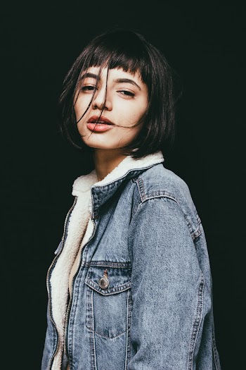 Woman Standing While Wearing Blue Chambray Jacket
