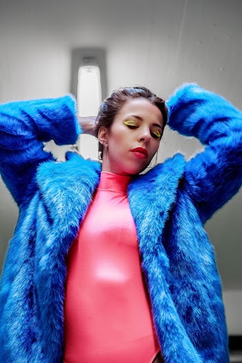 Woman Standing While Wearing Blue Fur Coat