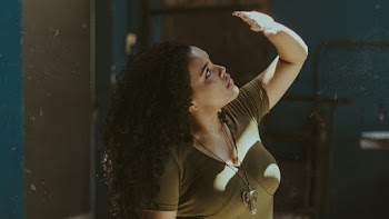 Woman Standing While Wearing Brown Shirt