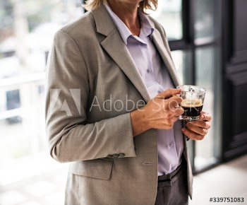 Woman standing with a cup of coffee
