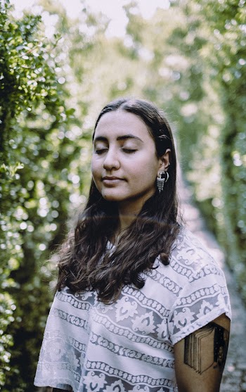 Woman Standing With Closed Eyes