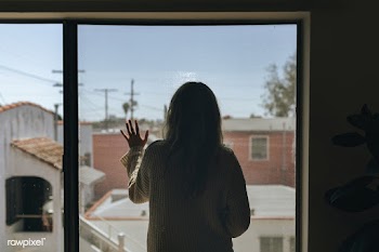 Woman staring out the window during a lockdown | Free  photo - 2328872