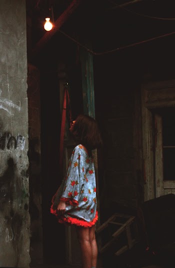Woman Starring at Bulb